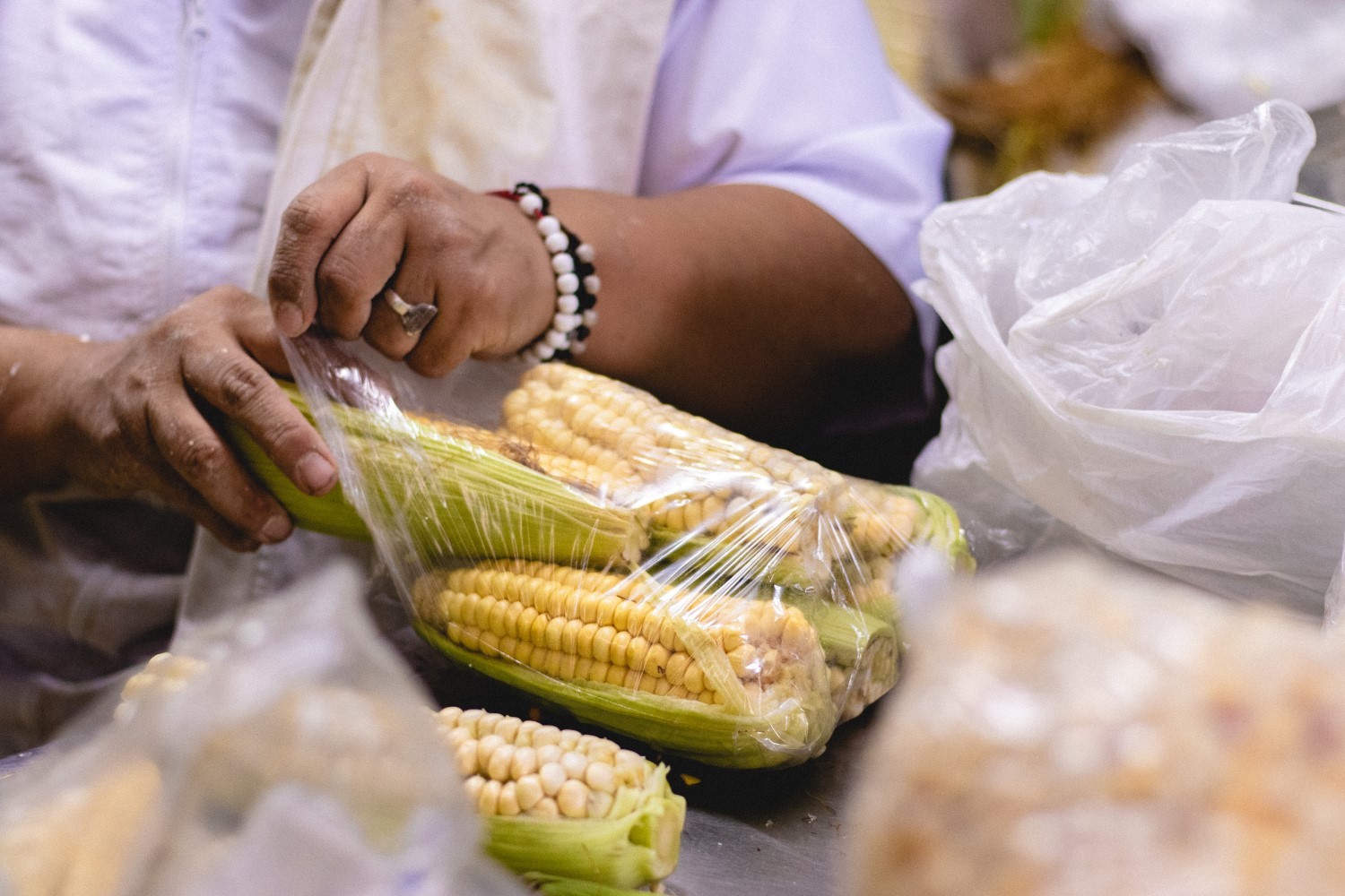 A picture containing person, food, corn

Description automatically generated